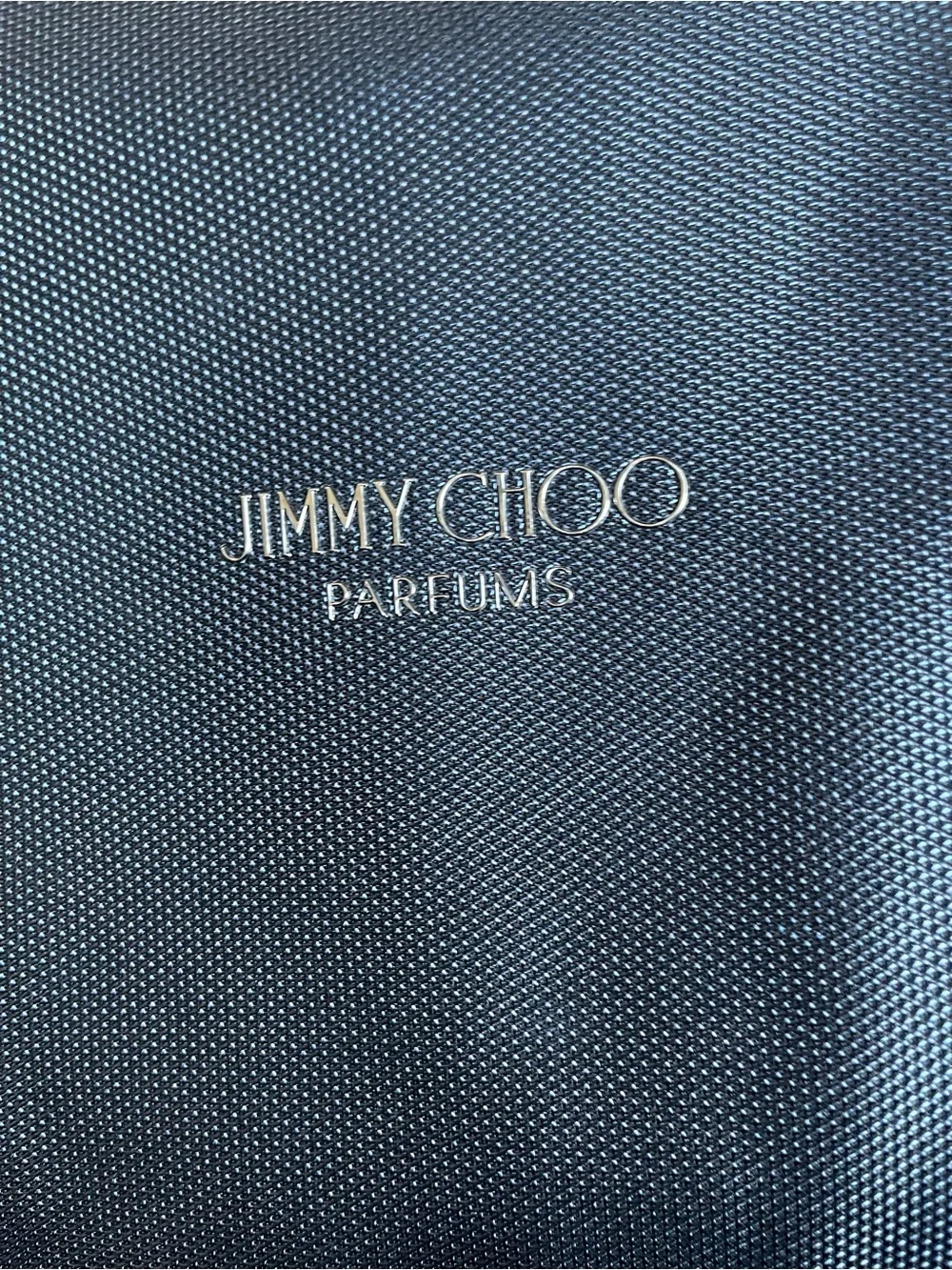 Large navy travel duffel from Jimmy Choo Parfums Durable fabric with leather